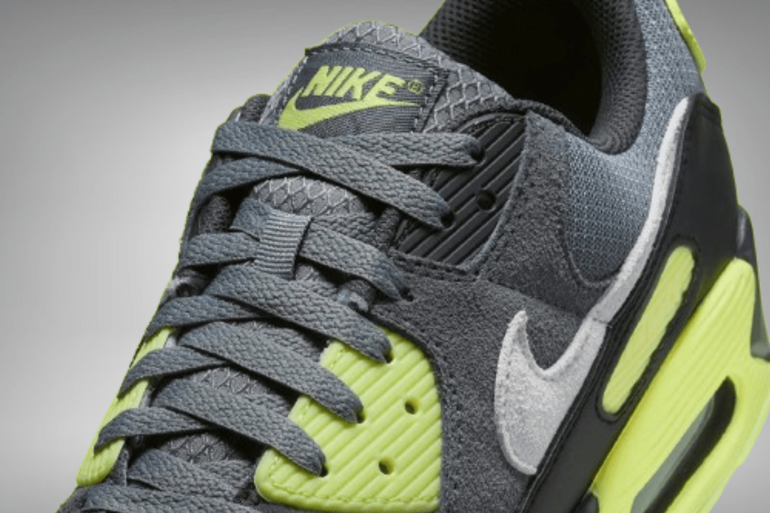 The Nike Air Max 90 appears in a 'Neon' colorway