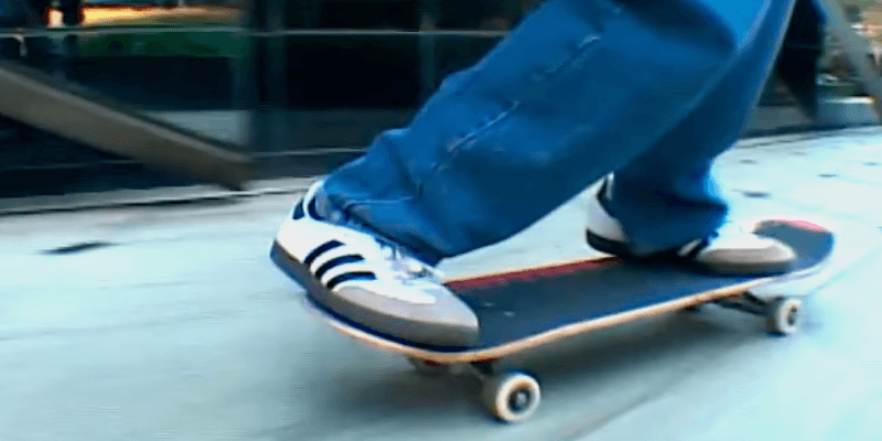 A person wearing Adidas Samba sneakers skating