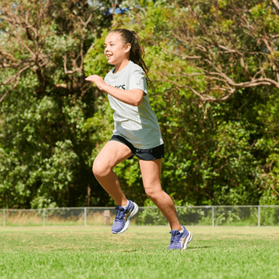 Child running while wearing Asics shoes