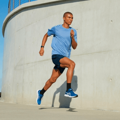 Man running while wearing Asics shoes