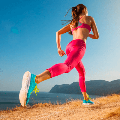 Women running while wearing Asics shoes