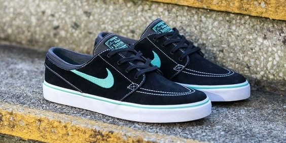 Black Nike SB Stefan Janoski with blue Swoosh on stairs