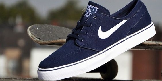 Blue Nike SB Stefan Janoski against skateboard