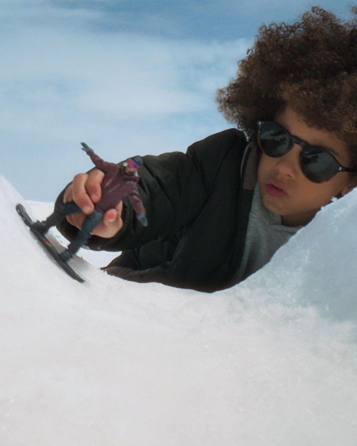 Kid playing in snow 