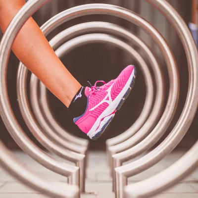 Woman wearing pink Mizuno running shoes