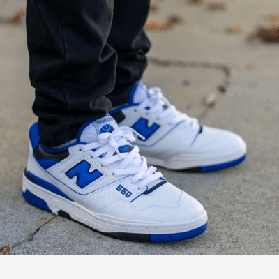 Boy wearing white and blue New Balance 550