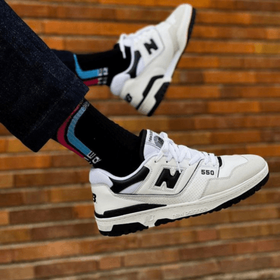 Man wearing black and white New Balance 550