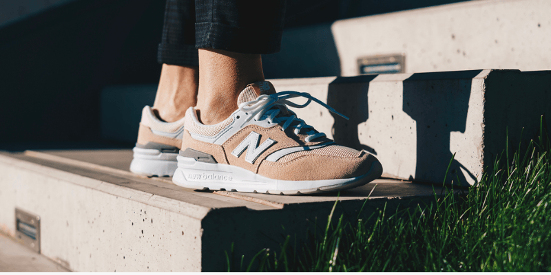 New Balance 997 pink on women's feet