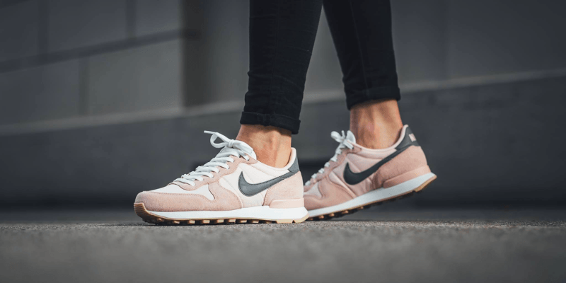 Nike Internationalist pink and green on women's feet