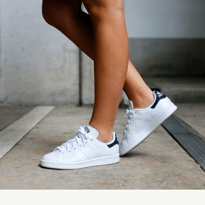 adidas Stan Smith white and navy on women's feet