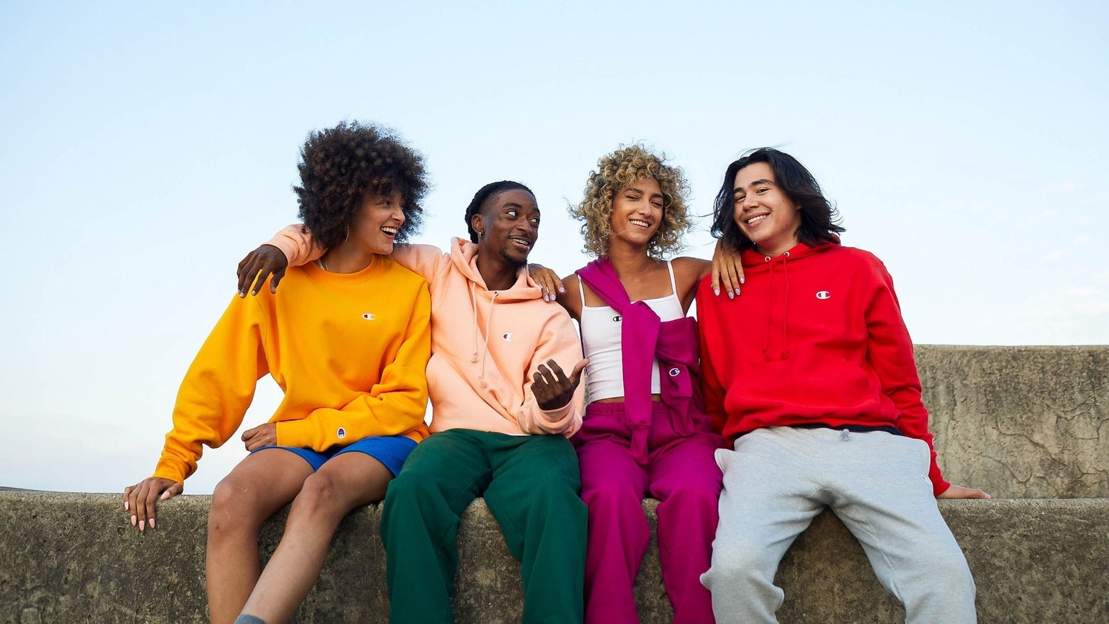 Champion models wearing colourful hoodies