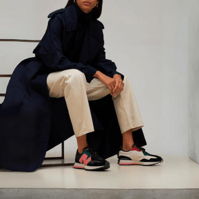 Woman sitting on a chair wearing New balance 327