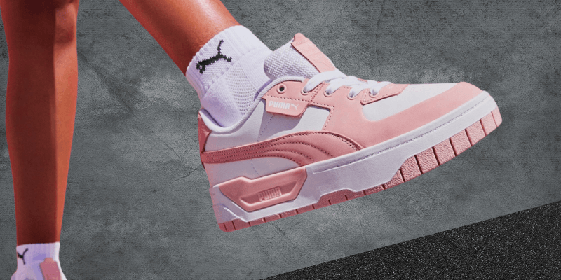 pink and white puma cali sneaker on feet womens