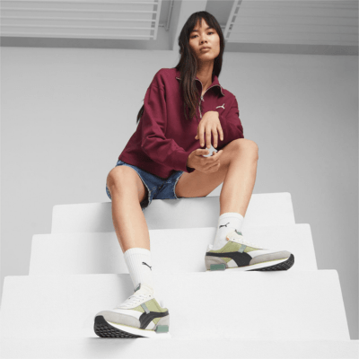 woman wearing puma future rider sneakers