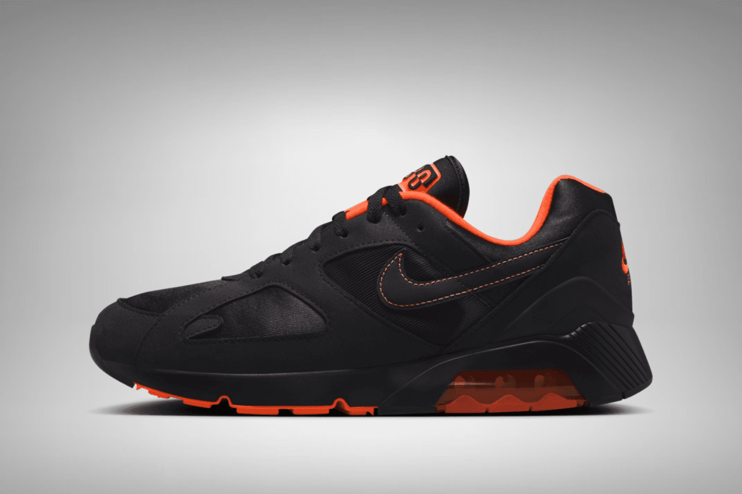 The Nike Air 180 appears in a 'Black &amp; Hyper Crimson' colorway