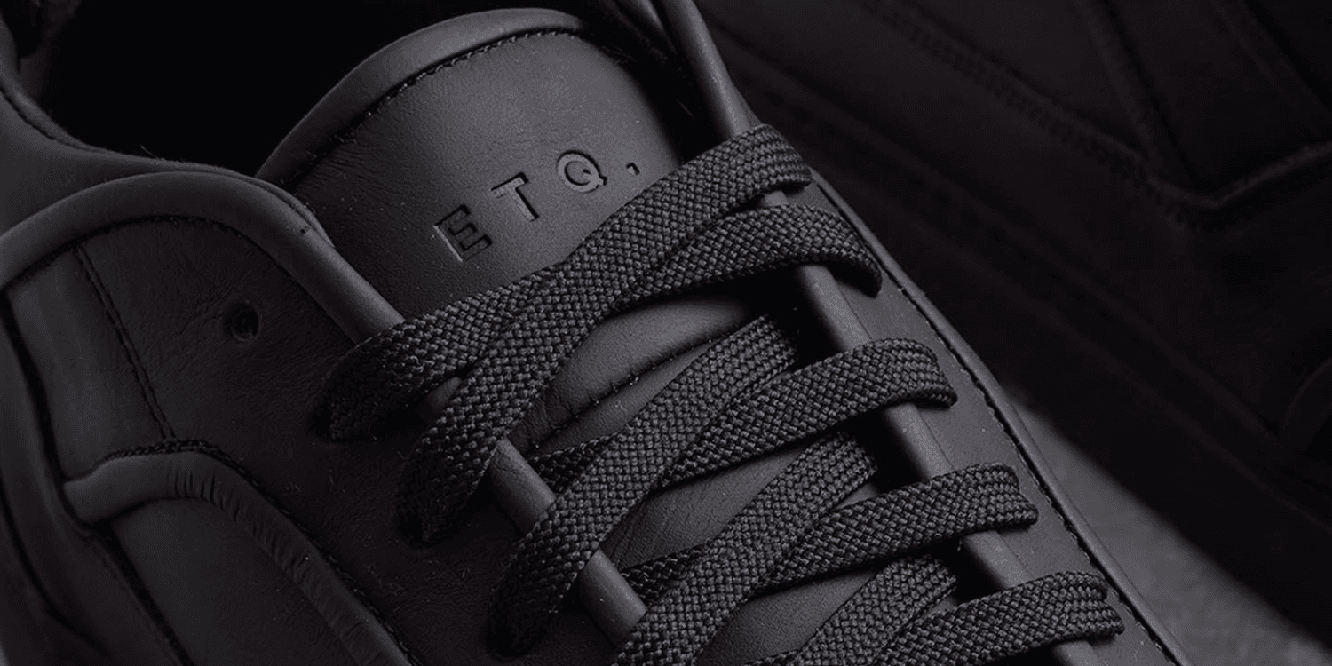 closeup of black ETQ sneaker laces and tongue